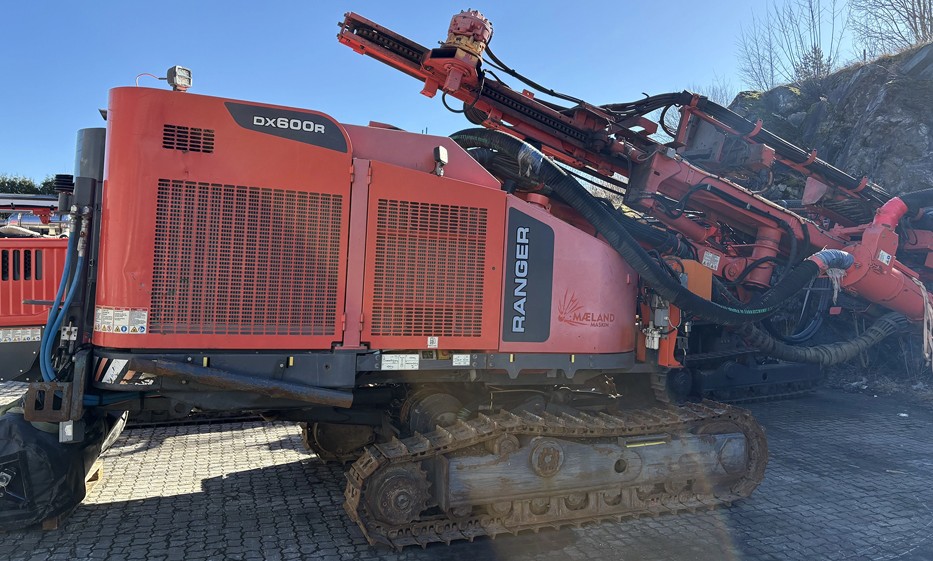 Sandvik Ranger™ DX600R surface drill rig operating on site, heavy-duty drilling equipment for mining and quarrying applications.