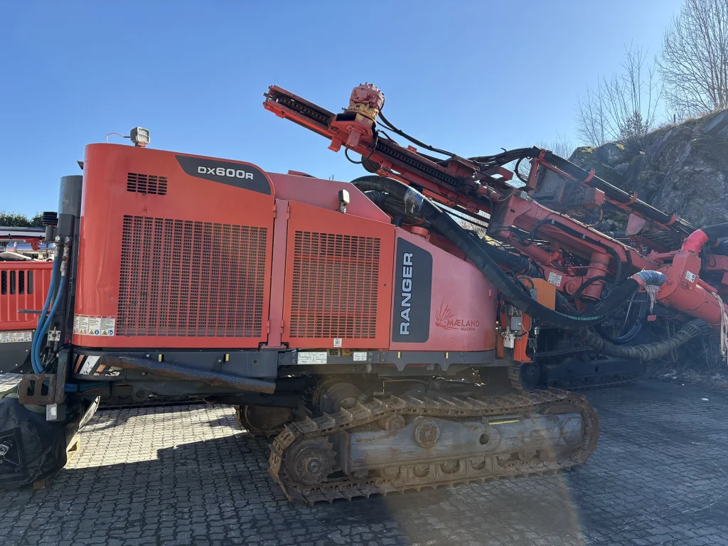 Sandvik Ranger™ DX600R surface drill rig operating on site, heavy-duty drilling equipment for mining and quarrying applications.