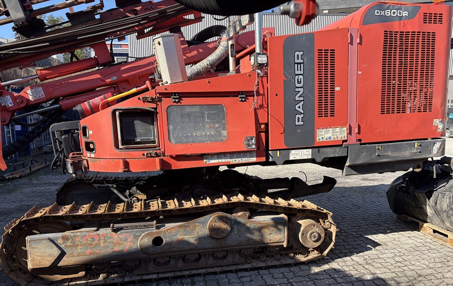 Sandvik Ranger™ DX600R surface drill rig operating on site, heavy-duty drilling equipment for mining and quarrying applications.