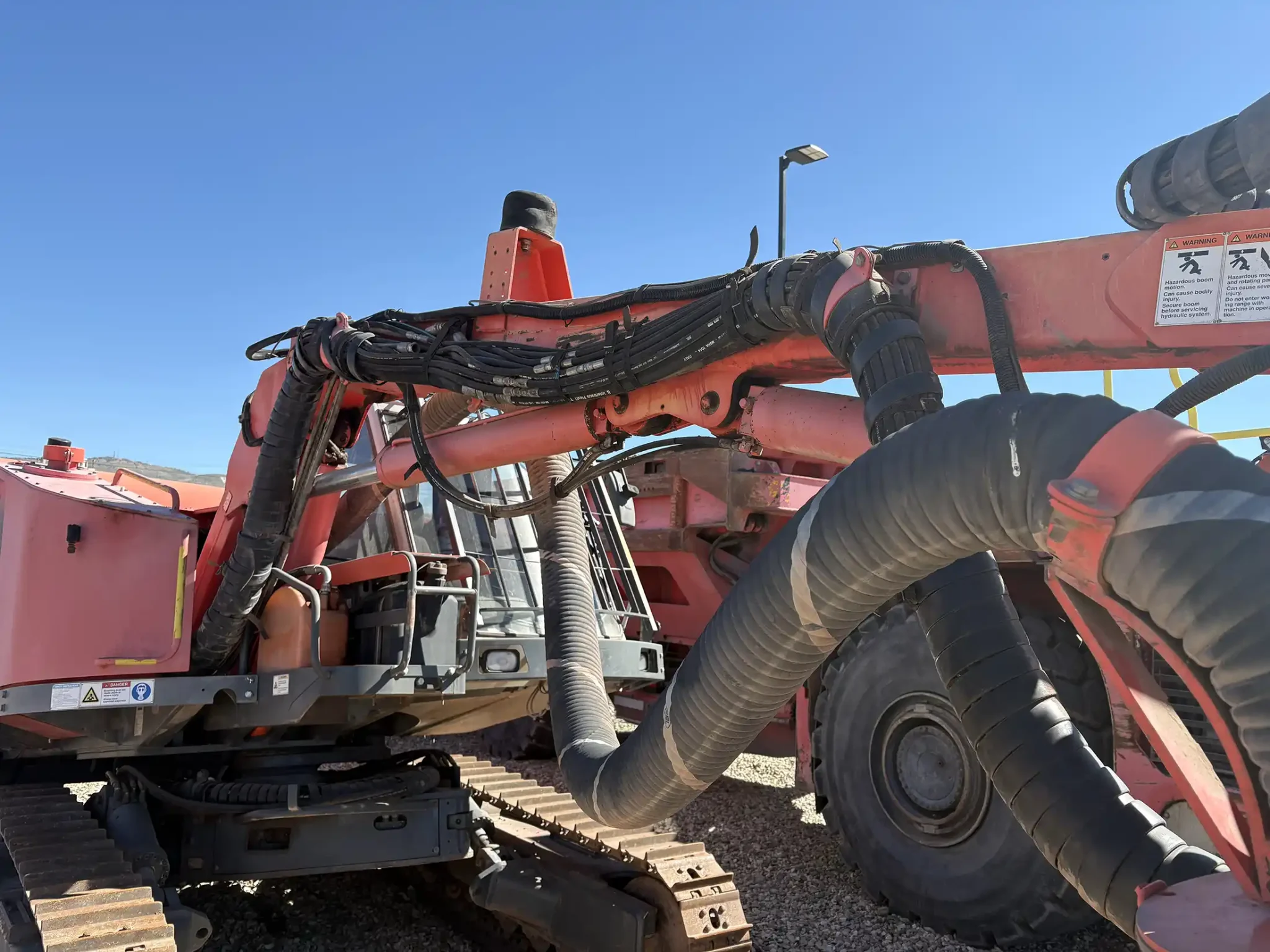 Sandvik Ranger™ DX800 surface drill rig operating on site, heavy-duty drilling equipment for mining and quarrying applications.